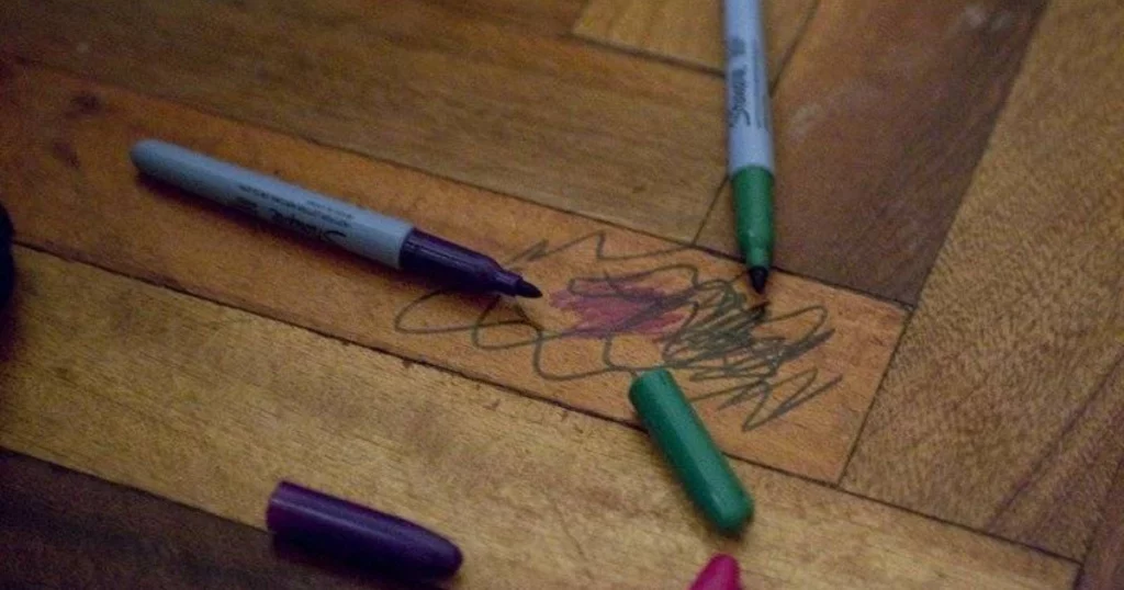 How to get crayon off wood
